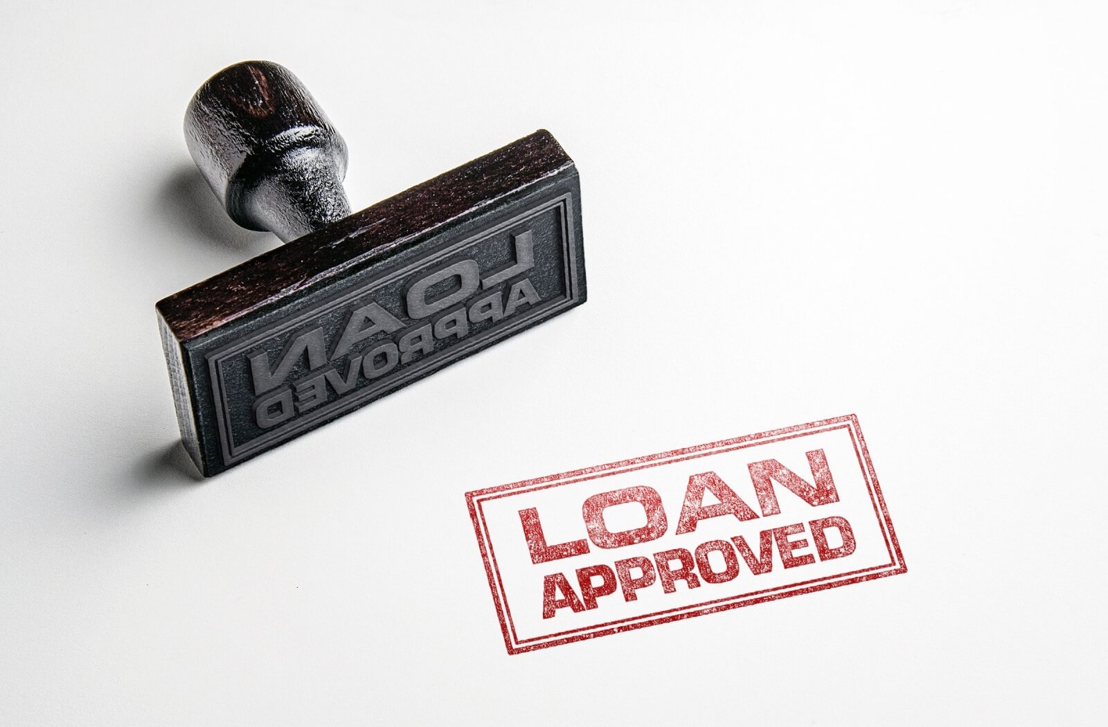 A rubber stamp that says "loan approved."