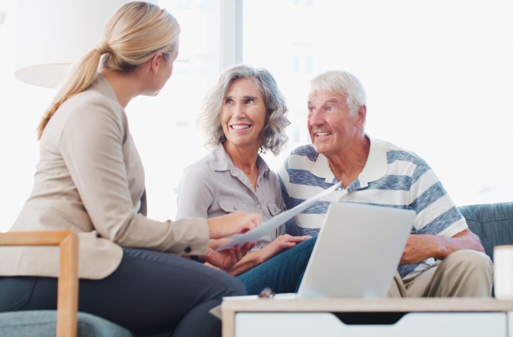 A mature couple visiting a credit union for an initial consultation.